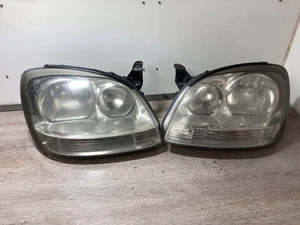 2005 NISSAN ALMERA PASSENGER & DRIVER SIDE FRONT HEADLIGHTS PAIR - Picture 1 of 13