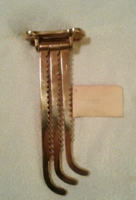 Percha de pared ajustable de tres puntas de latón macizo Gatco Foto 1 de 4