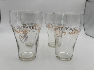 Coca-Cola International Trinkgläser GOLD Schriftzug (4er Set) 5 Sprachen. - Bild 1 von 7