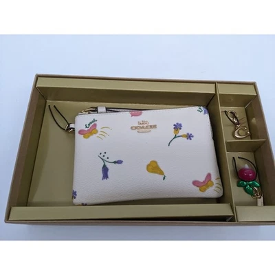 Muñequera Coach C8331 con cremallera en esquina con estampado vegetal de ensueño Foto 1 de 4