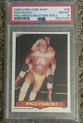 O-Pee-Chee 1985 OPC WWF #39 ¡Piggyback! Hulk Hogan Rookie PSA 8 casi nuevo-como nuevo Foto 1 de 3