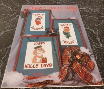 DH7 HAPPY HOLLY DAYS INCLUDING SANTA PAWS AND SANTA CLAWS CROSS STITCH DESIGNS - Image 1 of 4