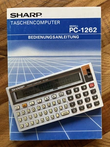 Sharp Pocket Computer PC-1262 Two lines working Calculator with manual  - Picture 1 of 4
