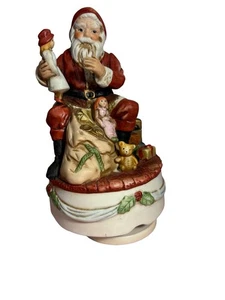 Caja de música giratoria vintage de cerámica de Papá Noel con juguetes reproduce "Noche de silencio" - Imagen 1 de 10