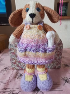 Hand Knitted Soft Toy Dog In Pinafore Dress With a Bone - Picture 1 of 12