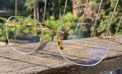Gafas doradas para hombres Gafas de titanio puro Gafas para mujeres Gafas sin montura Marco Foto 1 de 4