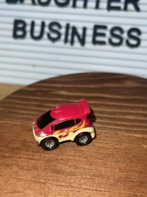Small Hasbro Micro Machine Mini SUV in Red with Yellow Flames - Image 1 of 4