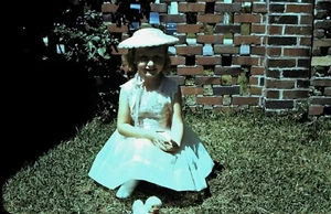 1950's Red Border Slide, Cute Red Headed Girl Sitting on grass in Period Dress - Picture 1 of 1