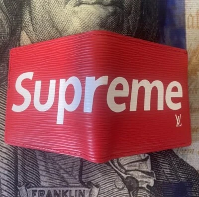 Cartera Supreme Louis Vuitton de cuero de lona roja Foto 1 de 4