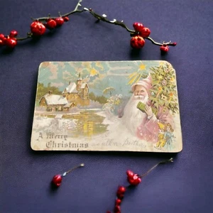 Antigua postal trasera indivisa de Santa del Viejo Mundo 1905, túnica roja, árbol, iglesia - Imagen 1 de 12