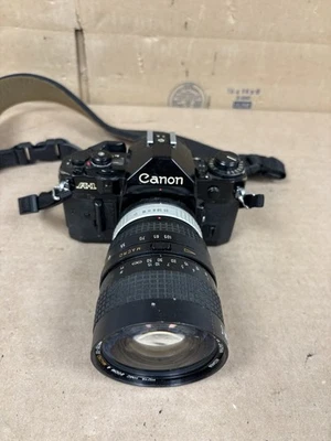 Cámara fotográfica Canon A-1 35 mm SLR con lente zoom Hoya Foto 1 de 4