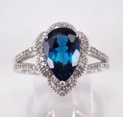 Anillo de mujer con halo de topacio azul Londres corte pera de 3,75 quilates oro blanco de 14 quilates Foto 1 de 4