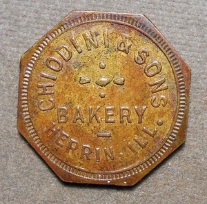D667 Herrin, Ill., Chiodini & Sons Bakery   Good For 1 Loaf Of Bread. Brass, oc - Picture 1 of 2