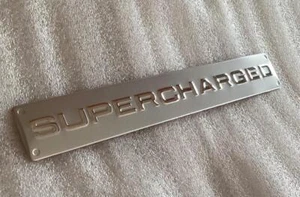 NEW SILVER/CHROME SUPERCHARGED BADGE FITS RANGE ROVER SPORT VOGUE DISCO - Picture 1 of 1