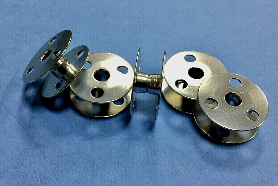 5X   Bobbin with 3 Holes (Alum.) 28mm  #155484101  Brother  - Image 1 of 1