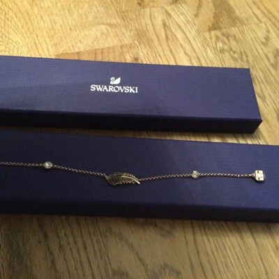 Pulsera plumas swarovski remix tono dorado 5495340 nueva en caja  Foto 1 de 3