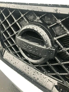 NEW OEM MIDNIGHT EDITION FRONT GRILLE EMBLEM - PATHFINDER XTERRA FRONTIER - Picture 1 of 4