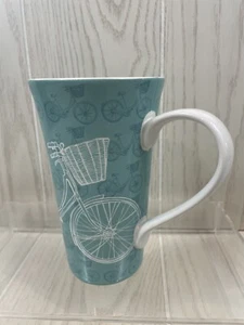 222 FIFTH TALL TURQUOISE BLUE COFFE TEA MUG BICYCLE WITH GARDEN BASKET Porcelain - Picture 1 of 9