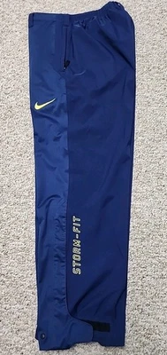 Calça Nike Storm-Fit azul com amarelo Swoosh masculina tamanho G cordão encaixe tornozelo zíper  - Imagem 1 de 4