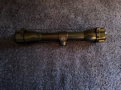 Mira telescópica punto central 4x32. Con fundas para lentes.  Foto 1 de 4