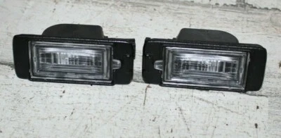 2013-2014 Cadillac ATS Rear License Plate Lamp NEW OEM 13578958 - Image 1 of 4