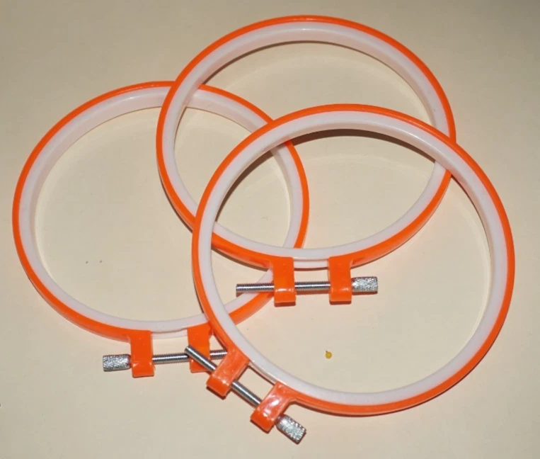 Three, 4" Diameter, Plastic, Orange and White, Round Hoops with Metal Screws - Image 1 of 2