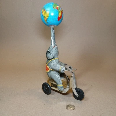 Vintage Wind Up Tin Circus Elephant Toy on Bike w/Spinning Globe  Works - Image 1 of 4