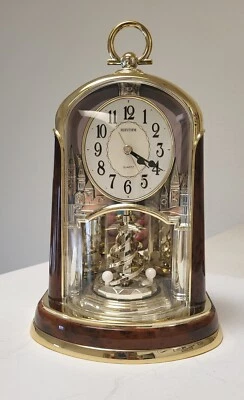 RHYTHM Clock Woodgrain Spiral Pendulum, Model #4SG713WS23, Excellent Condition  - Image 1 of 4