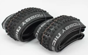 2 pneumatici pieghevoli Schwalbe Nobby Nic 29x2,40 SuperTrail ADDIX Soft EVO SnakeSkin TLE - Foto 1 di 5