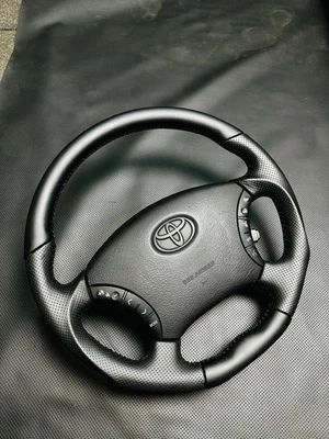 Black Perforated Leather Steering Wheel Fits in Toyota Tacoma, Tundra, 4Runner. - Image 1 of 3