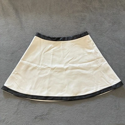 Minifalda Banana Republic blanca línea A con ribete de cuero negro para mujer talla 6 Foto 1 de 4