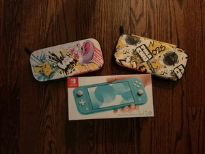 Nintendo Switch Lite Excellent Condition Includes New Cases - Picture 1 of 1