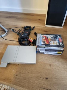 PS2 slim Konsole mit Memory Card, ohne Controller(!), mit ein paar Spielen - Bild 1 von 3