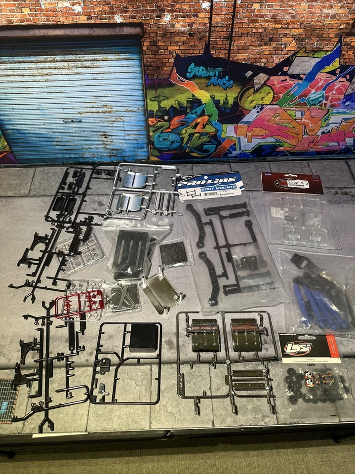 1/14 Tamiya Grand King Globe Knight hauler Spare Parts Plus 1/10 Spare Parts Lot - Image 1 of 4