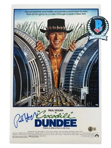 PAUL HOGAN SIGNED CROCODILE DUNDEE AUTOGRAPH 11X17 PHOTO BECKETT BN96759 - Picture 1 of 4