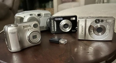 Lot 4 Cameras Nikon Canon Kodak &Vivicam Plus Spider Propel USB - Image 1 of 4