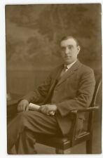 RPPC Handsome Man Sitting in Chair Holding Papers Studio Portrait Postcard