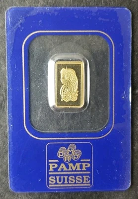 Barra Fortuna dorada de 1 gramo Pamp Suisse en tarjeta de ensayo de plástico Foto 1 de 2