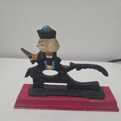 Cascanueces de hierro fundido Paul Revere Soldier base de madera colores vibrantes nunca usado de colección Foto 1 de 4