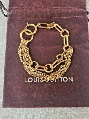 Auténtico brazalete Louis Vuitton de fiesta con muelles de palma tono dorado Foto 1 de 4