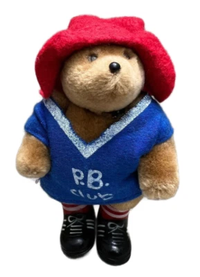 Pequeño oso Paddington de peluche Eden Toys 1987 vintage con P.B. Camisa azul club Foto 1 de 4