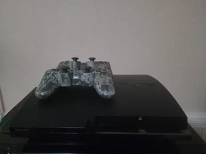 PS3 slim console 2001 /W 2 Camo controllers with all cables Test Reset. - Picture 1 of 6