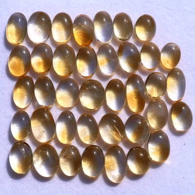 Wholesale 38 Pcs Natural Citrine Untreated 10mm-15mm Oval Cabochon Gemstones Lot - Image 1 of 4