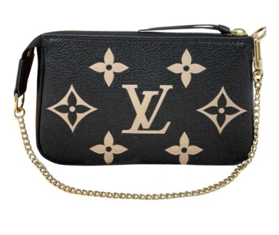 LOUIS VUITTON Mini Pochette Bicolor Monogram Empreinte Accessoires Pouch Black - Image 1 of 4