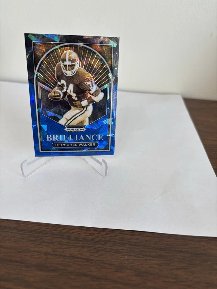 2023 Panini Prizm Draft Picks #BR-14 Herschel Walker Brilliance Blue Ice #/99 - Image 1 of 4