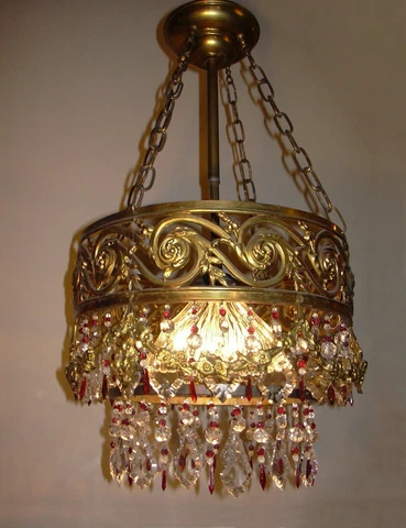 Antique gilded cascading crystal Chandelier with red raspberry accents, 1920's Cover