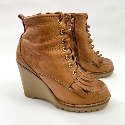 Botas de combate Tory Burch con cordones de cuña suela de 8 M Foto 1 de 4