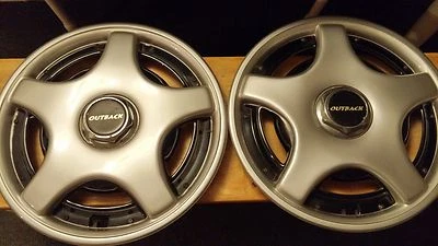 Juego de 2 cubiertas de rueda de tapacubos originales Subaru impreza Outback 1995-1997 14 pulgadas Foto 1 de 4