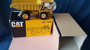 NZG CAT 769C OFF ROAD EARTH TYPE MOVER 1/50TH WHEEL NEEDS REPAIR NR MINTBOXED - Picture 1 of 8