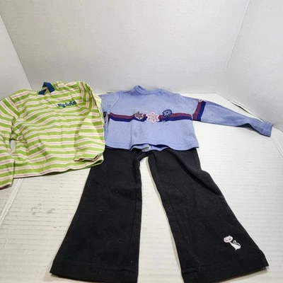 Lote de 3 pantalones elásticos negros y 2 camisas de manga larga My Twinn 23" para muñecas  Foto 1 de 3